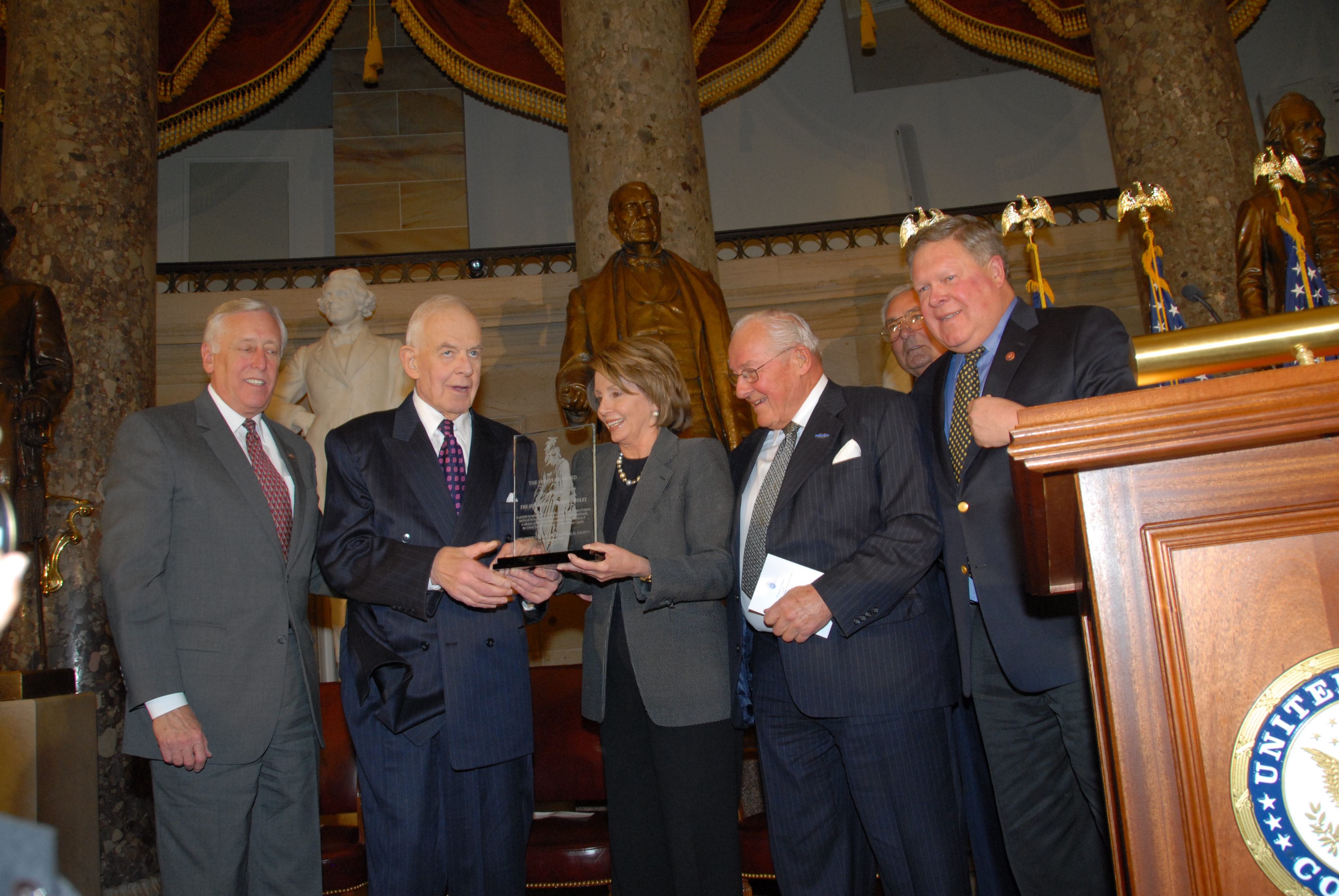 Speaker Nancy Pelosi presents the 2007 Freedom Award to Tom Foley (second from left) as Democratic leader Steny Hoyer, former Republican leader Bob Michel, Society President Ron Sarasin, and Congressman Norm Dicks look on.