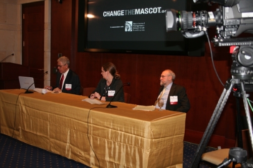 The panel of speakers fields questions during a question and answer segment.