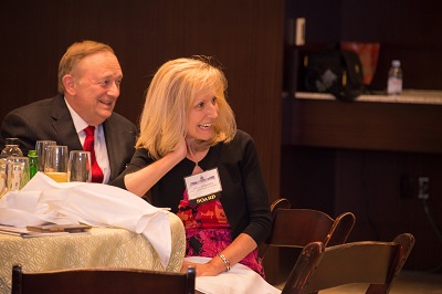 Don Carlson (PwC) and Anna Schneider (Volkswagen) listening to the panelists humorous stories.