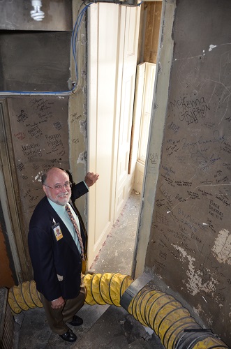 Steve Livengood highlights the passage from the enclosed staircase to the West Terrace. Photo (c) Bruce Guthrie