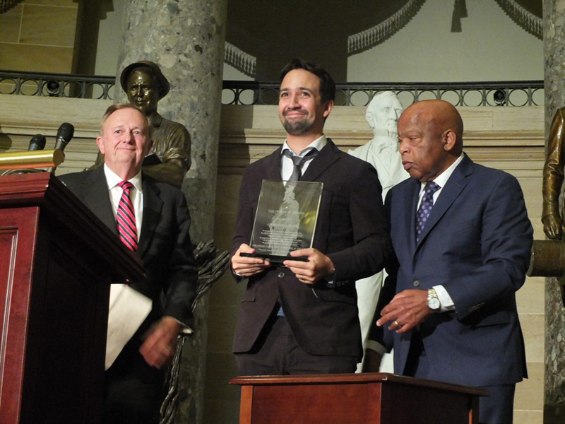Playwright Lin-Manuel Miranda receiving the 2017 Freedom Award from 2014 recipient, Congressman John Lewis
